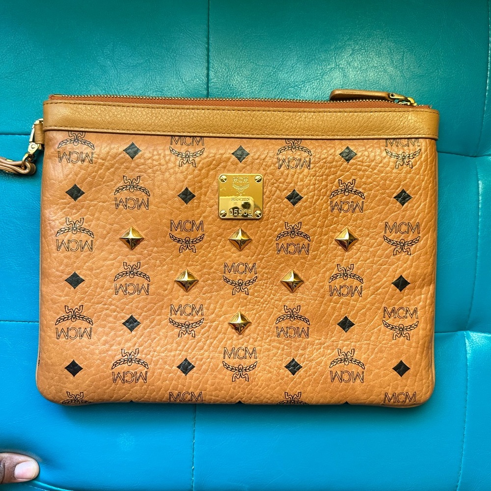 MCM Med Visetos wristlet. Measure 0.4 x 11.6 x 8.5 inches